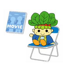 椅子に座っているハッピーこまちゃんの画像とMOVIEの文字